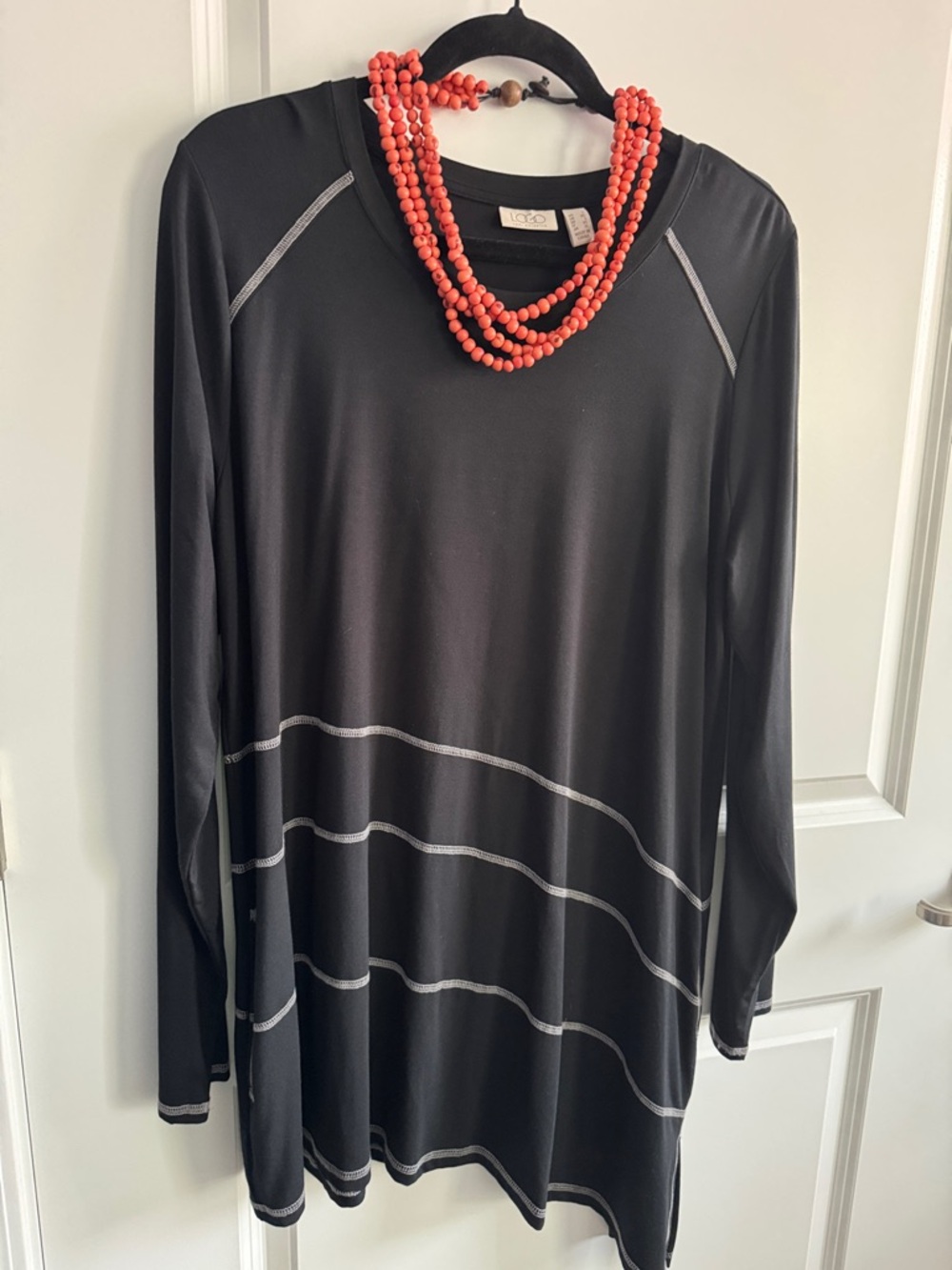 LOGO by Lori Goldstein black tunic with angled hemline. Pockets. Never worn.